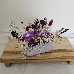 Apportez une ambiance douce et raffinée à votre intérieur avec ce bouquet de fondants parfumés framboise noire vanille.