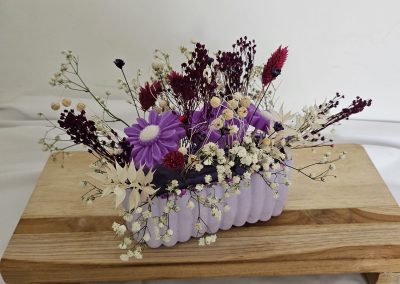 Apportez une ambiance douce et raffinée à votre intérieur avec ce bouquet de fondants parfumés framboise noire vanille.